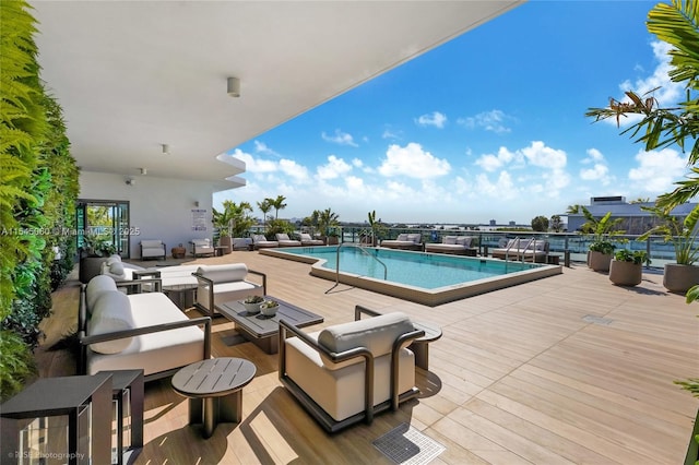 9901 W Bay Harbor Dr Unit 303, Bay Harbor Islands, FL 33154 - community pool with outdoor lounge area and a deck