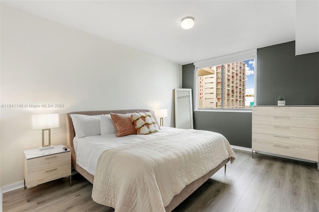 bedroom with hardwood / wood-style floors