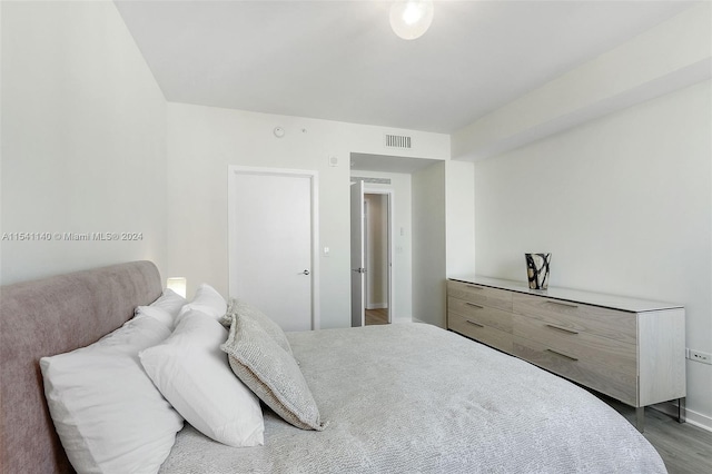 bedroom featuring hardwood / wood-style floors