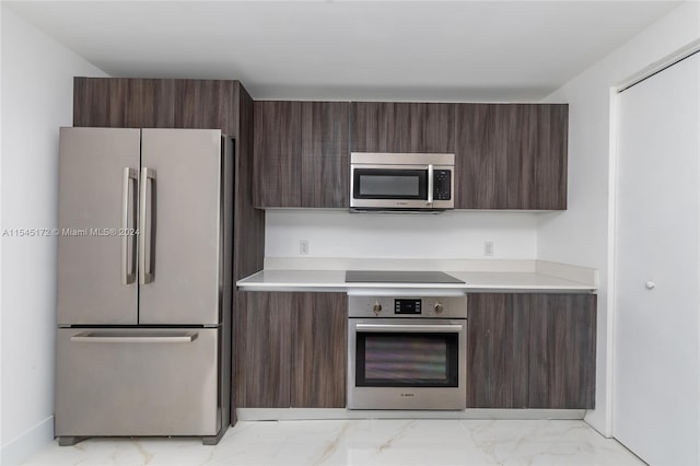 kitchen with dark brown cabinets and stainless steel appliances