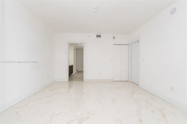 unfurnished bedroom featuring a closet