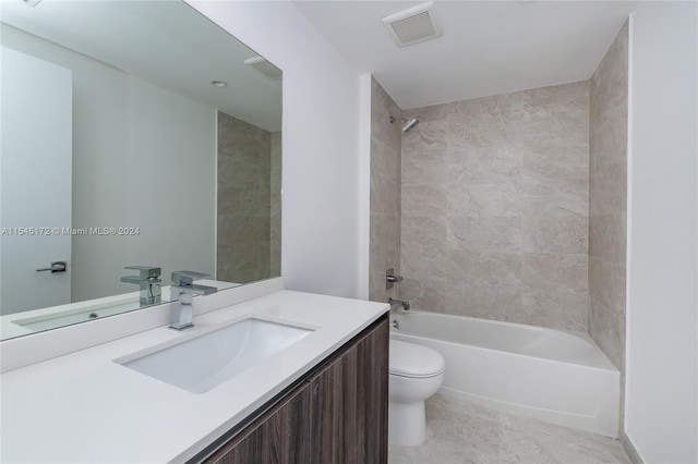 full bathroom with vanity, tiled shower / bath combo, toilet, and tile patterned flooring