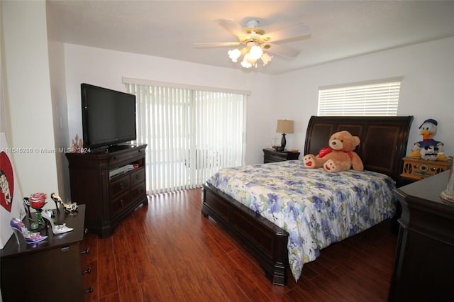 bedroom featuring access to exterior, dark hardwood / wood-style flooring, and ceiling fan