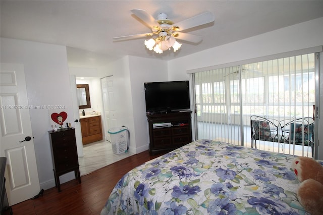 bedroom with ensuite bath, ceiling fan, and dark wood-type flooring