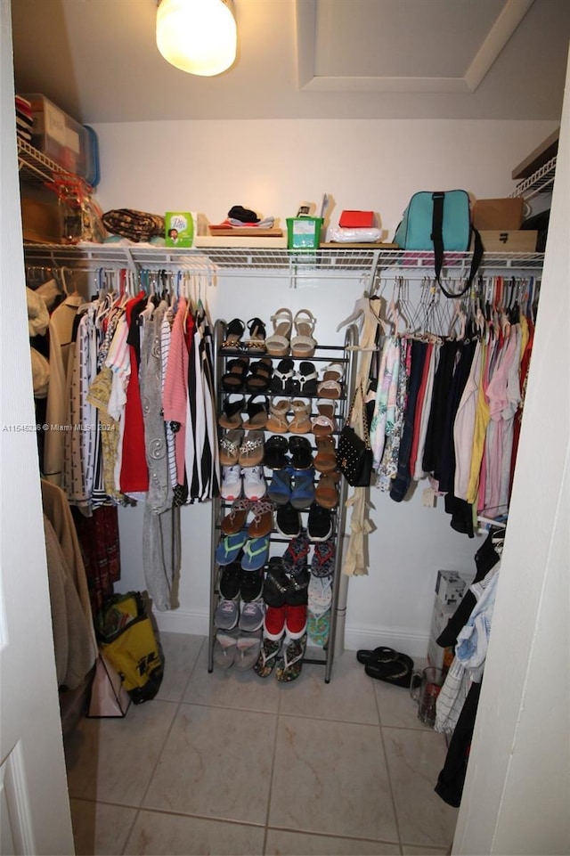 spacious closet featuring tile patterned floors