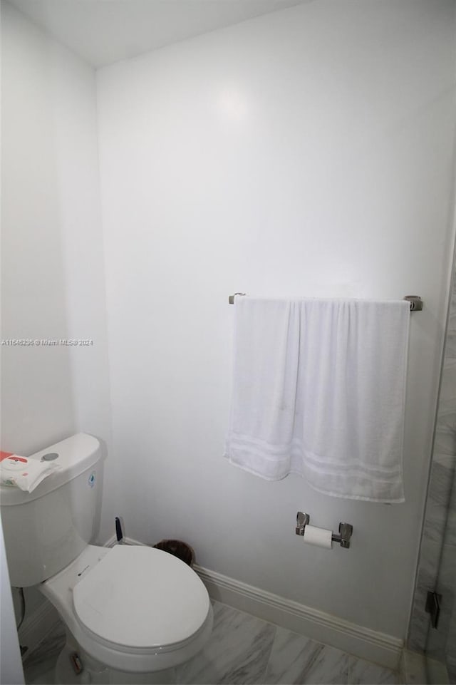 bathroom featuring toilet