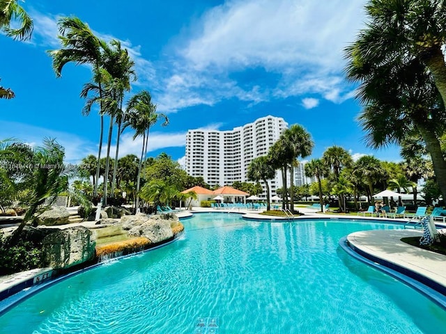 view of pool with pool water feature