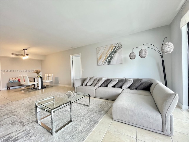 living room featuring light tile floors