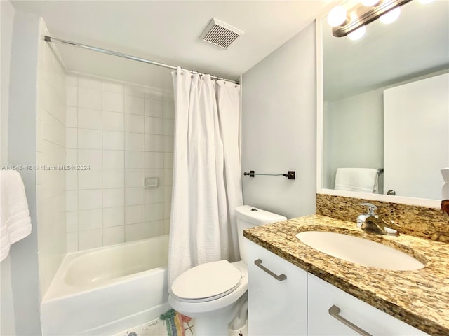 full bathroom featuring toilet, shower / tub combo, vanity, and tile flooring