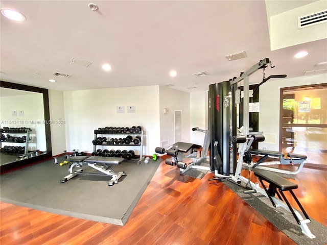 exercise area with hardwood / wood-style flooring