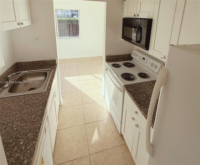 kitchen with white cabinetry, white appliances, light tile patterned flooring, and sink