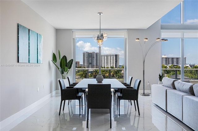 dining space with light tile floors, a wall of windows, and an inviting chandelier