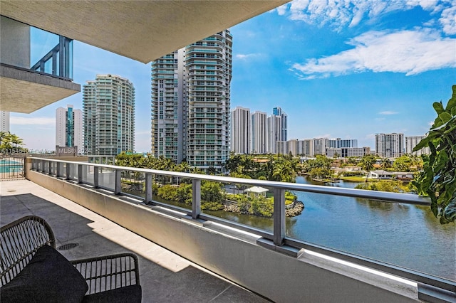 balcony featuring a water view