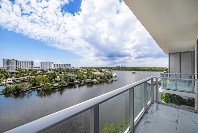 balcony featuring a water view