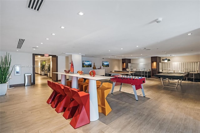 recreation room featuring pool table and light hardwood / wood-style flooring