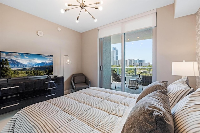 bedroom with access to outside and a chandelier