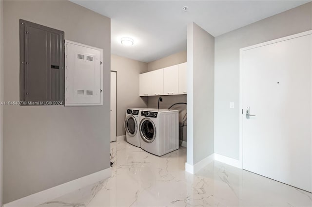 washroom featuring washer and dryer, light tile flooring, hookup for an electric dryer, and cabinets