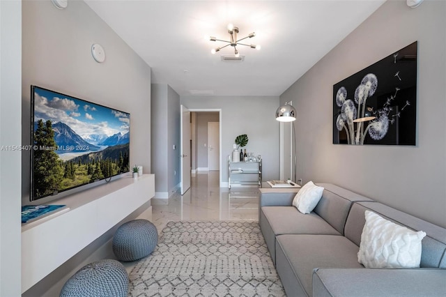 tiled living room featuring a notable chandelier