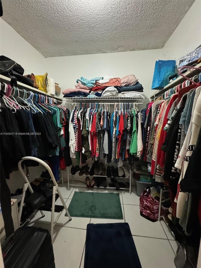 spacious closet with tile patterned flooring