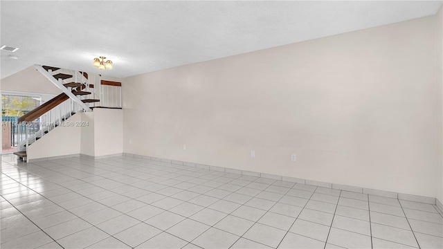 unfurnished room featuring light tile patterned floors