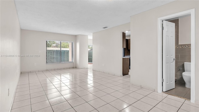 tiled empty room with tile walls