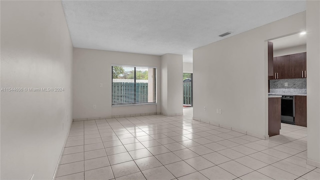 unfurnished room featuring light tile patterned floors