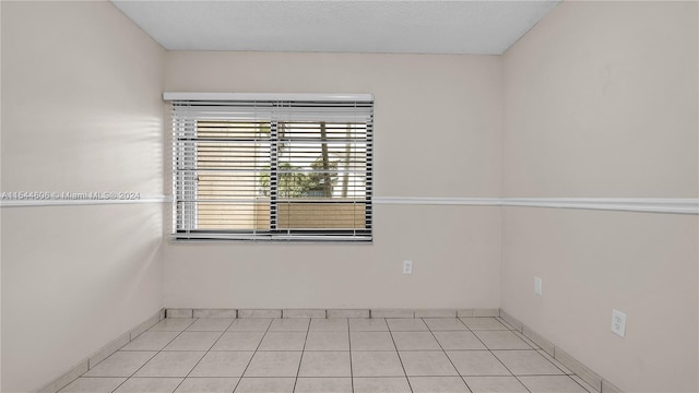 view of tiled spare room