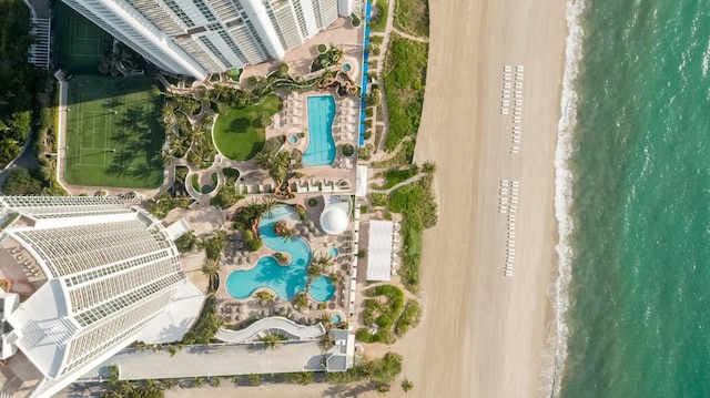 birds eye view of property featuring a view of the beach and a water view