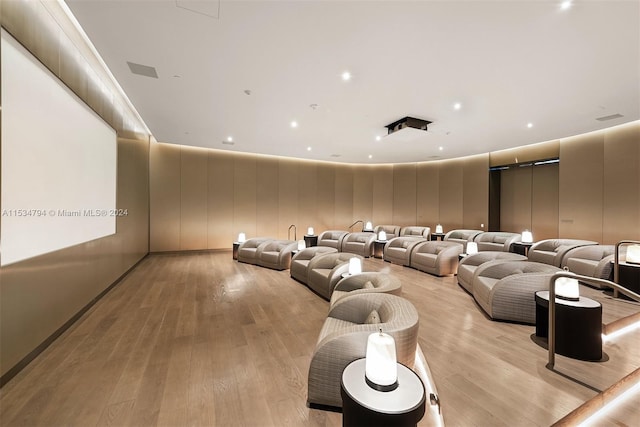 home theater room featuring light wood-type flooring