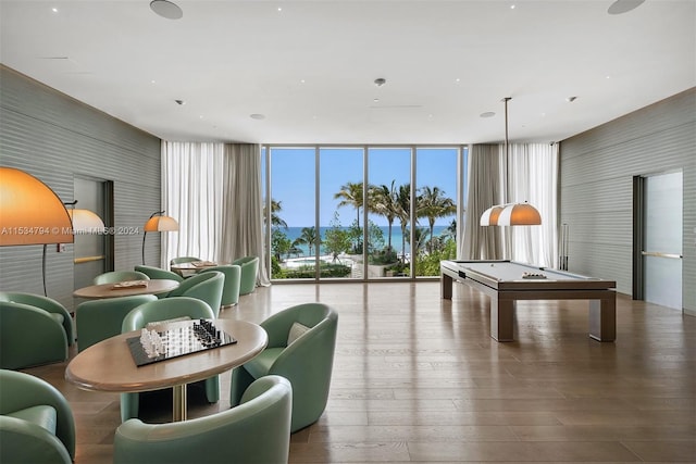 recreation room with hardwood / wood-style flooring, floor to ceiling windows, and pool table