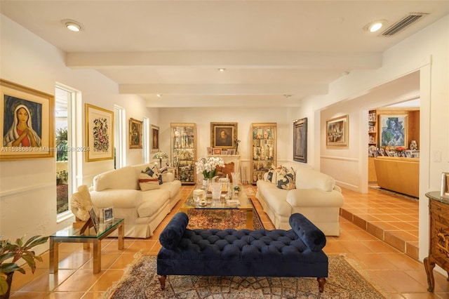 tiled living room with beamed ceiling