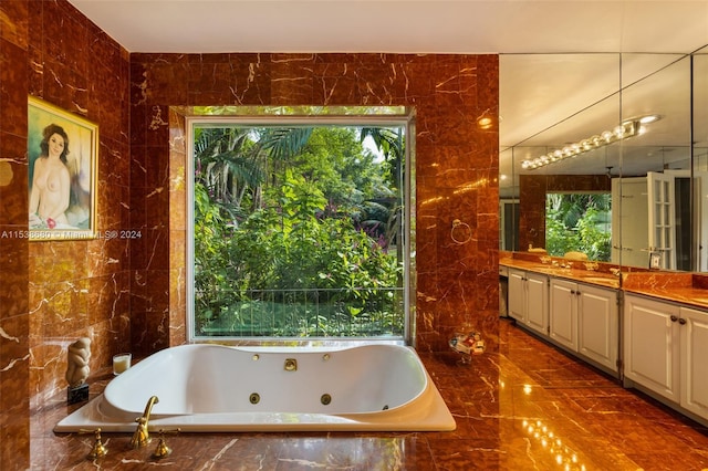 bathroom featuring vanity, tile flooring, and tile walls