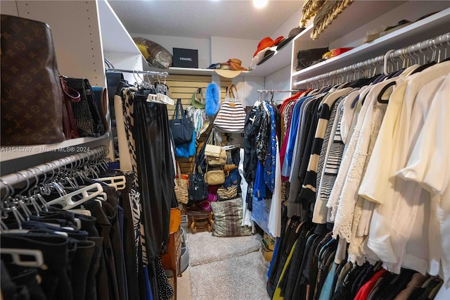 walk in closet featuring carpet