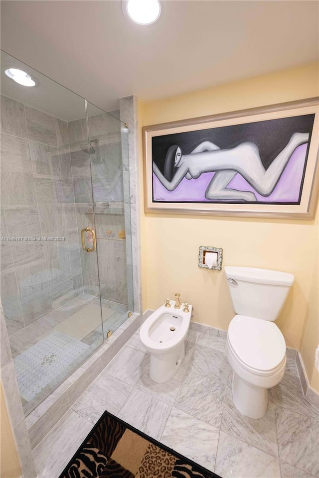 bathroom with toilet, walk in shower, and a bidet