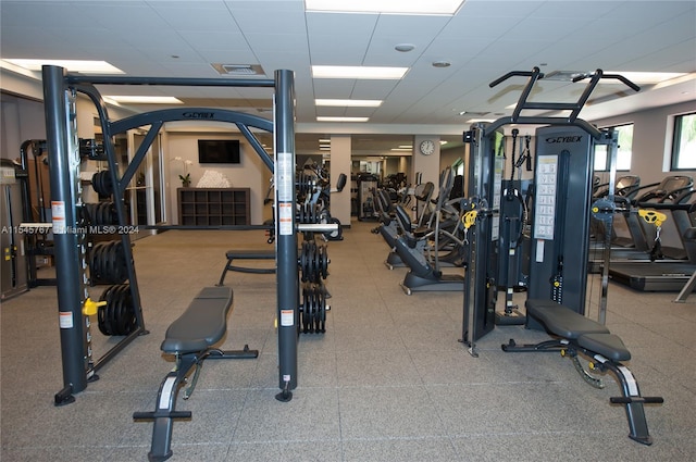 exercise room with a drop ceiling