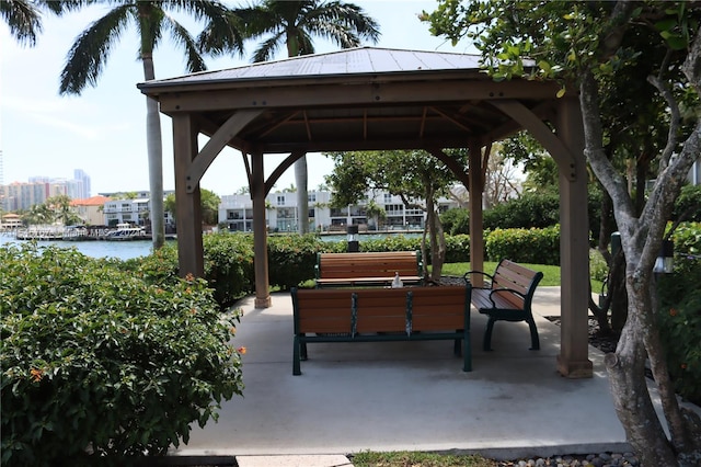 view of community with a gazebo and a water view