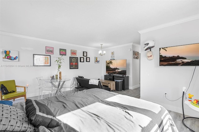 bedroom with a notable chandelier, crown molding, and wood-type flooring