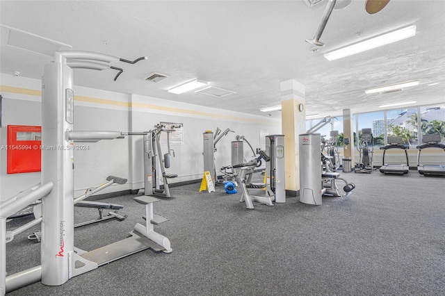 gym featuring a textured ceiling