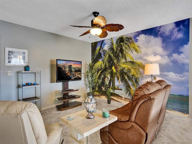 living room with light tile flooring, ceiling fan, and a textured ceiling