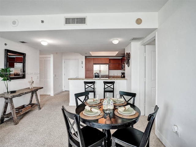 view of carpeted dining area