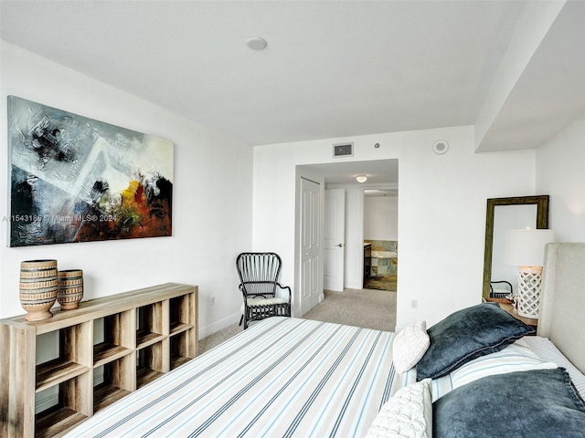 bedroom featuring light carpet