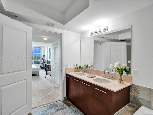 bathroom featuring tile floors and dual vanity