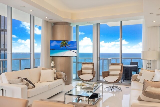 living room featuring floor to ceiling windows and plenty of natural light