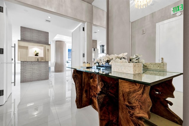 kitchen with a notable chandelier and light tile patterned floors