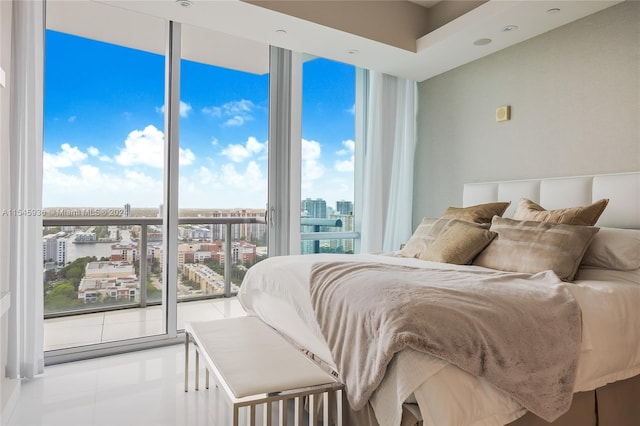 tiled bedroom with a wall of windows