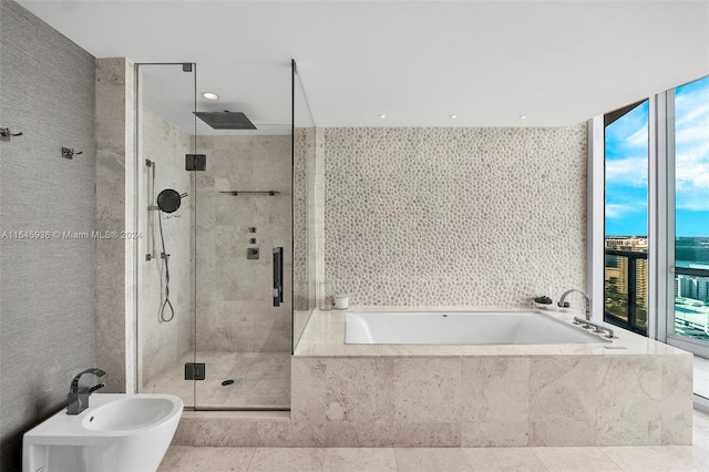 bathroom featuring tile patterned floors, plus walk in shower, sink, and a bidet