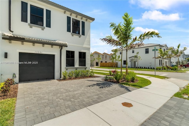 mediterranean / spanish house featuring a garage