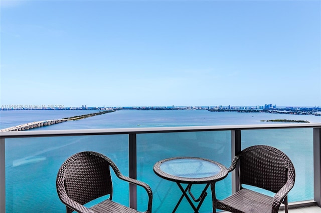 balcony featuring a water view