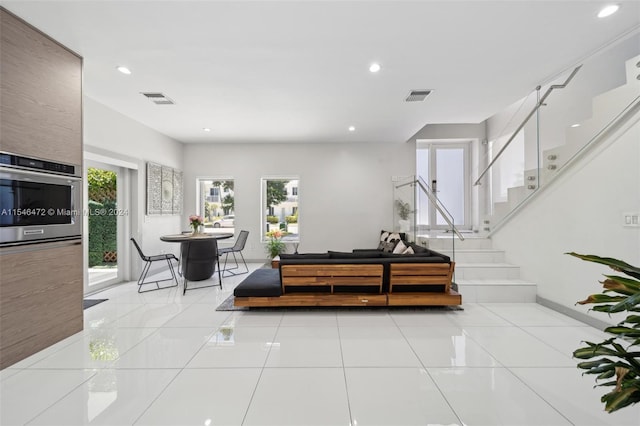 living room featuring light tile patterned flooring