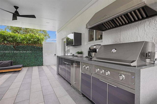 view of patio featuring sink, ceiling fan, and exterior kitchen